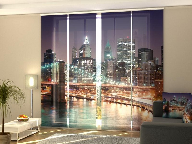 a room with a large window with a city view