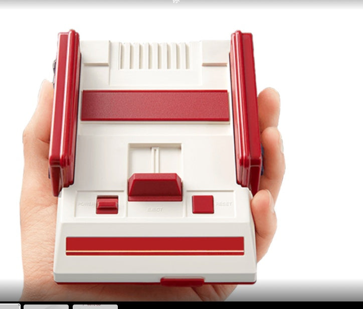 a hand holding a white and red device