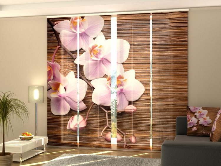 a room with a couch and a picture of flowers
