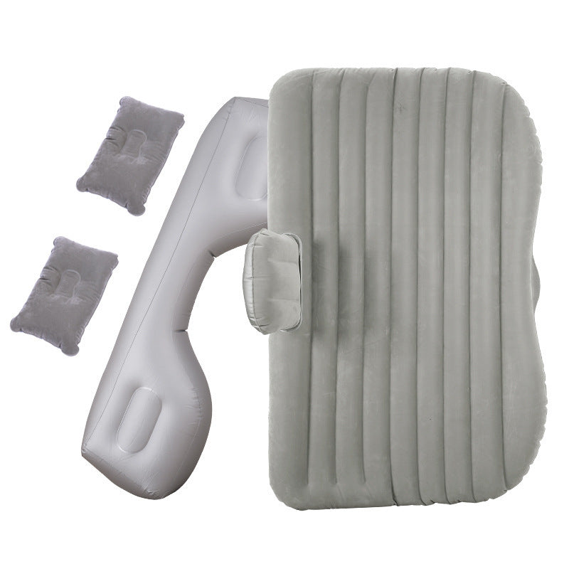 a grey inflatable mattress and pillows