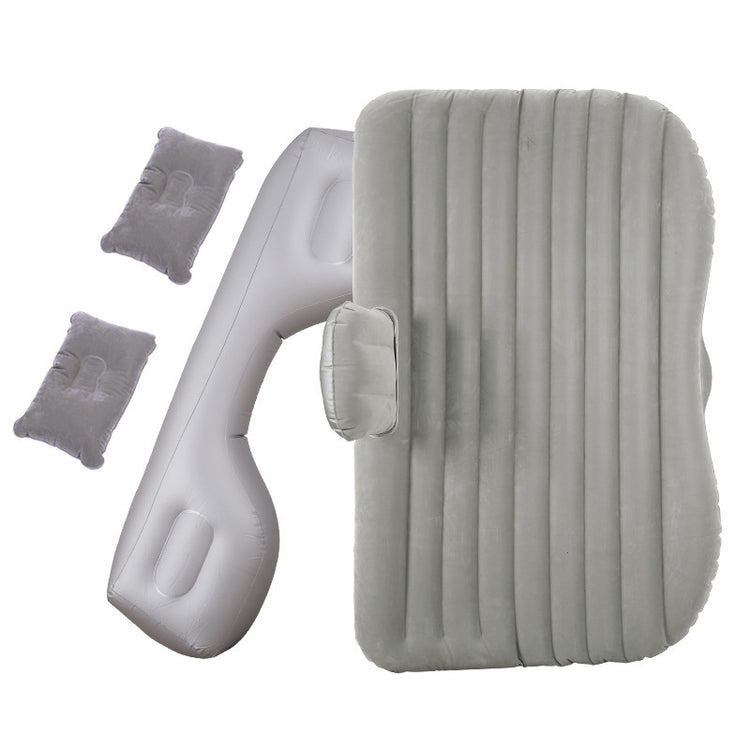 a grey inflatable mattress and pillows