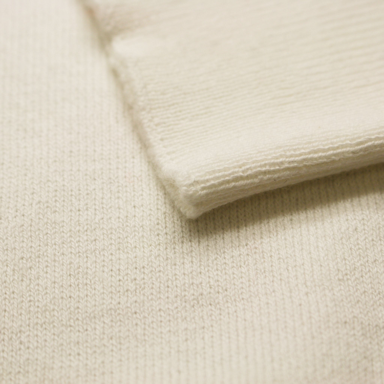 a close up of a white knitted fabric