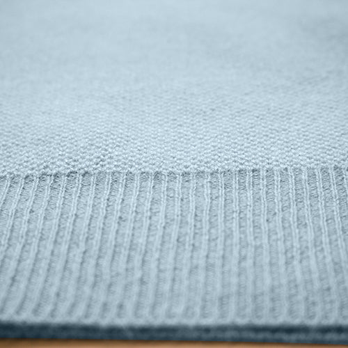 a close up of a blue knitted fabric