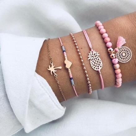 a person's wrist with bracelets