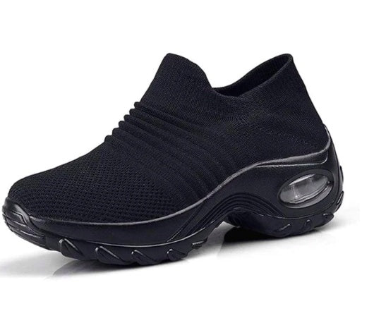 a black shoe on a white background