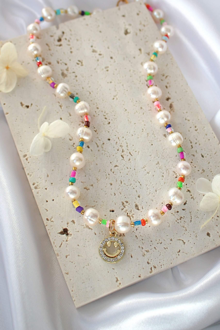 a necklace with colorful beads and a pendant