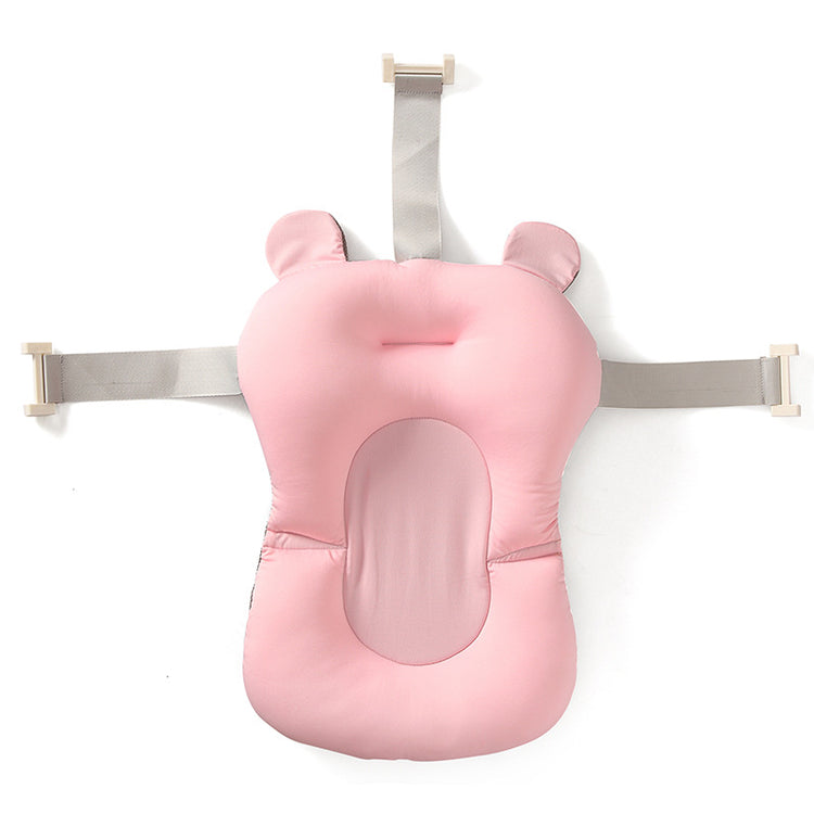 a pink baby seat with straps
