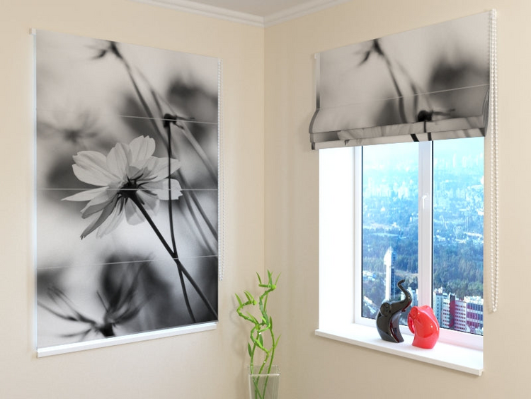 a window with a picture of flowers and a vase with a plant