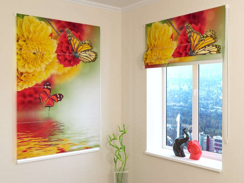 a window with a picture of flowers and a vase with a statue