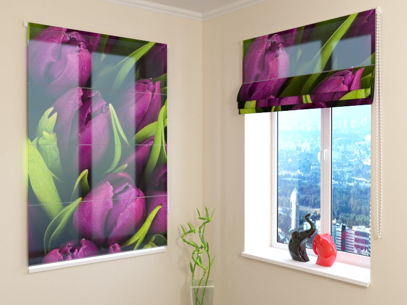 a window with a picture of purple tulips and a vase with a red object on the window sill