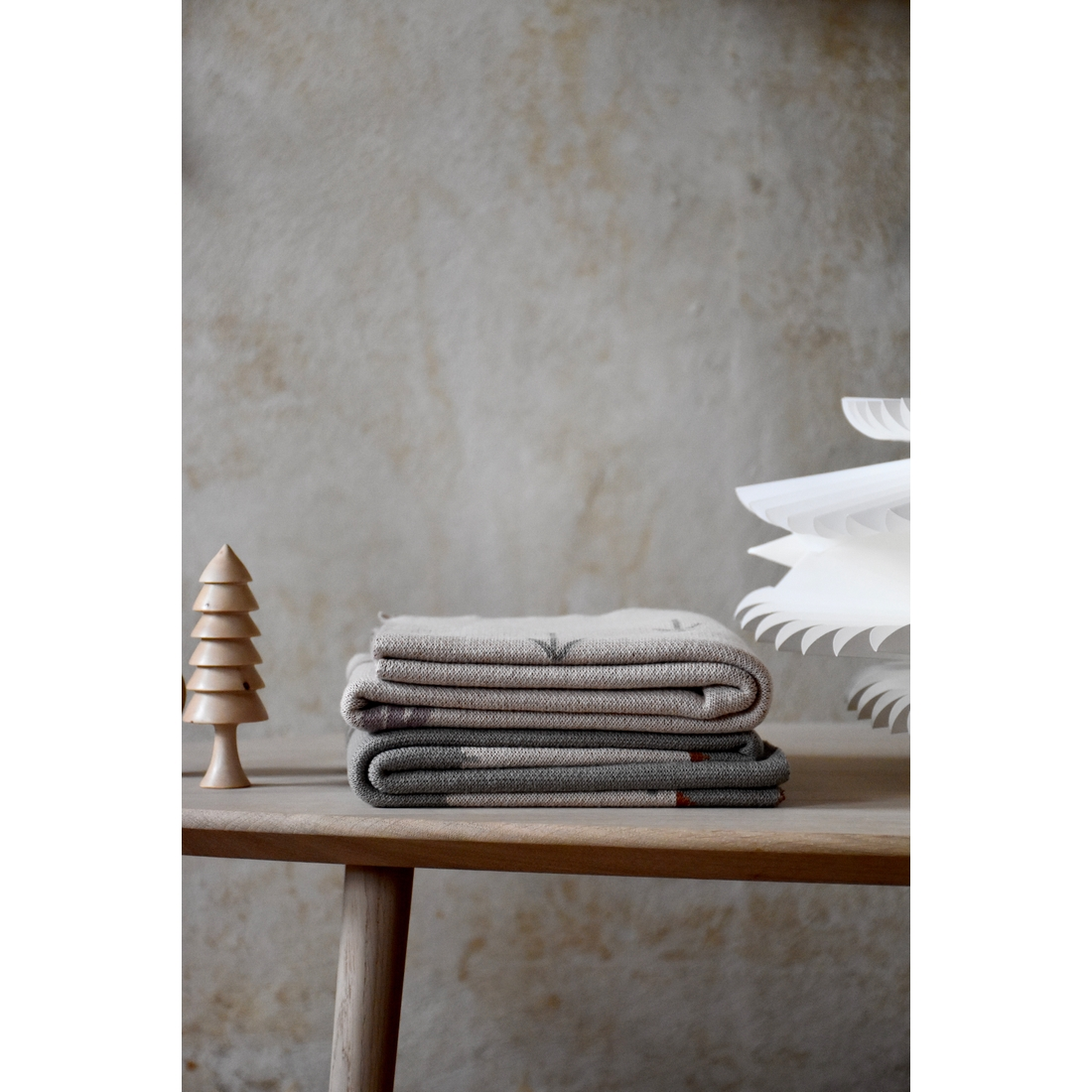 a stack of blankets on a table