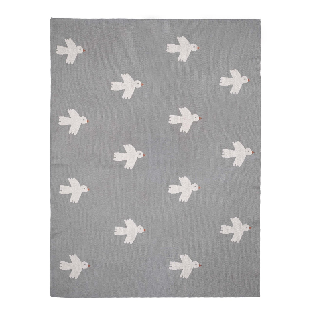 a grey rug with white birds on it