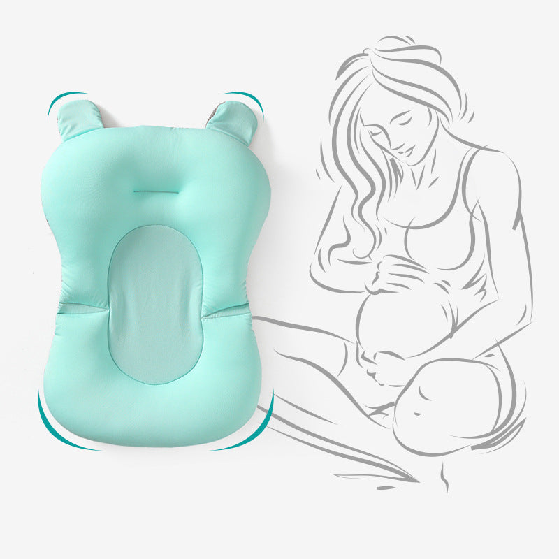 a baby pillow with a pregnant woman in her lap