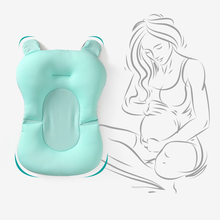 a baby pillow with a pregnant woman in her lap