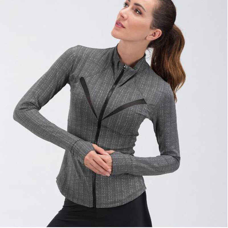a woman in a grey jacket