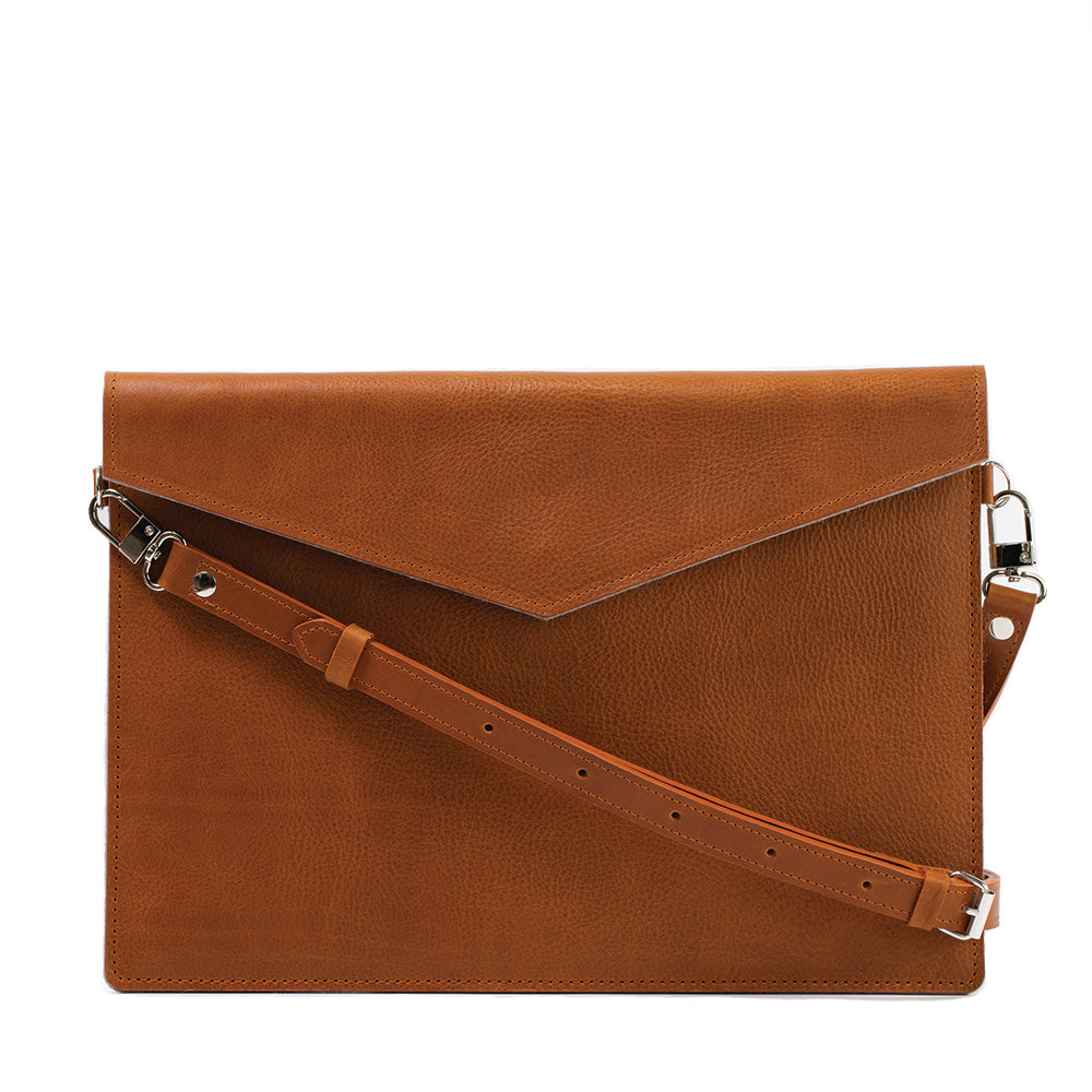 a brown leather bag with a strap