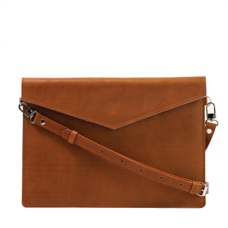 a brown leather bag with a strap
