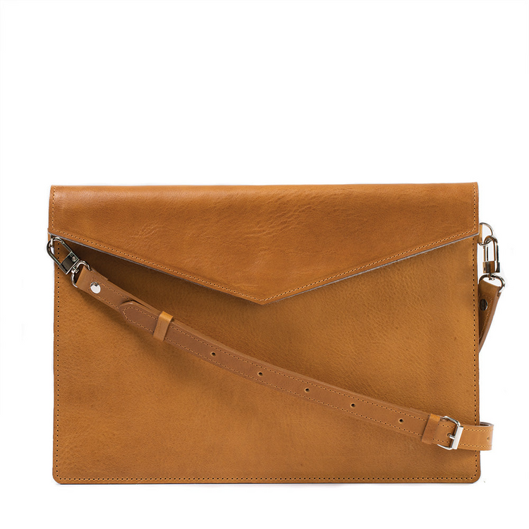 a brown leather bag with a strap