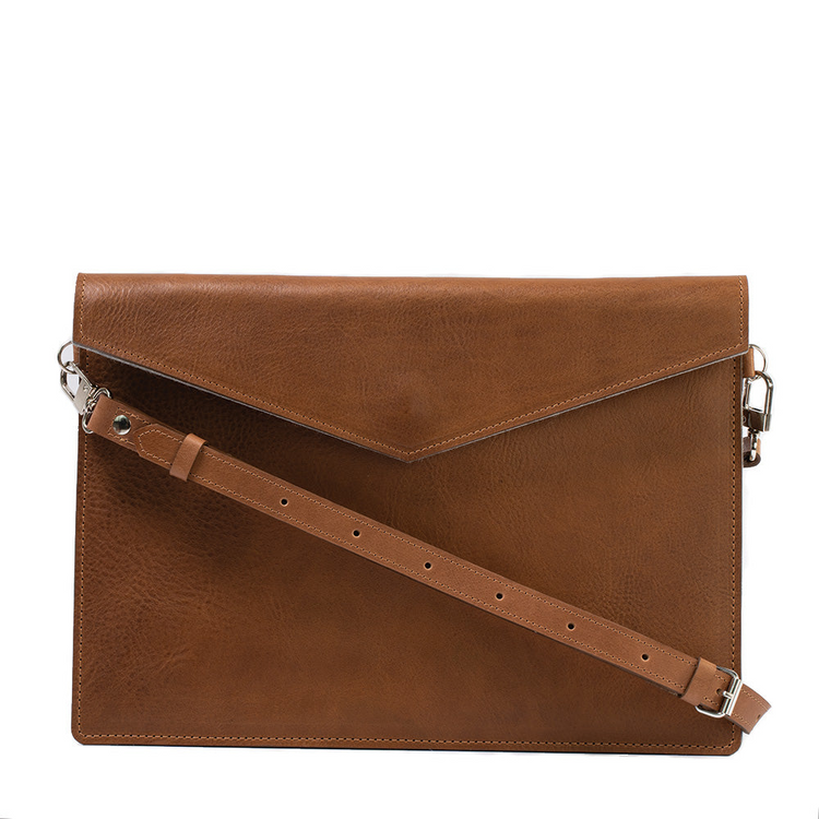 a brown leather bag with a strap