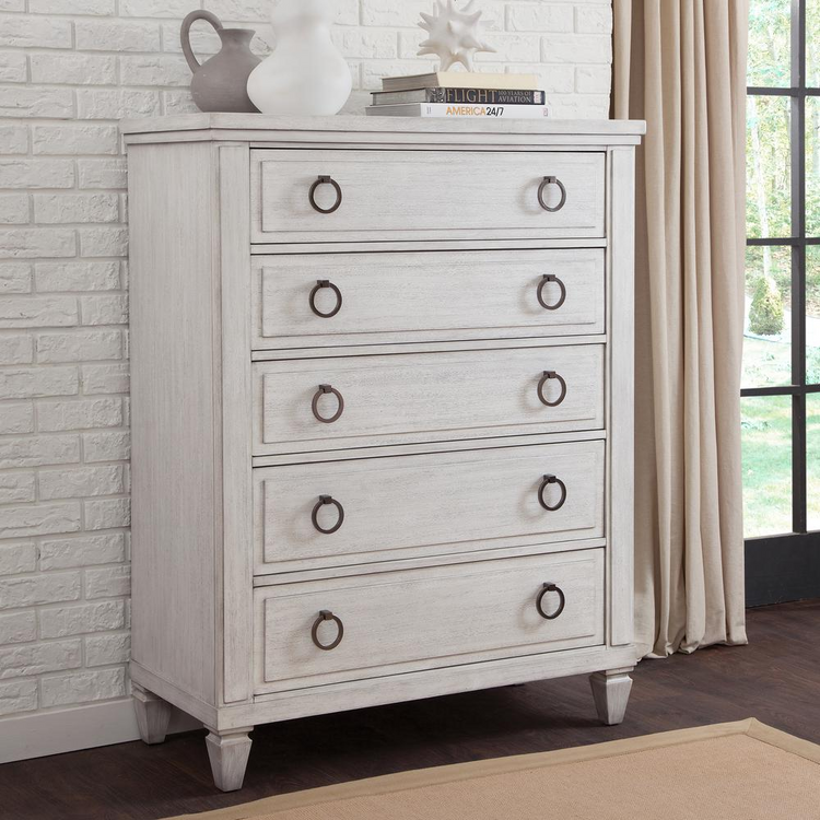a white dresser with a vase on top