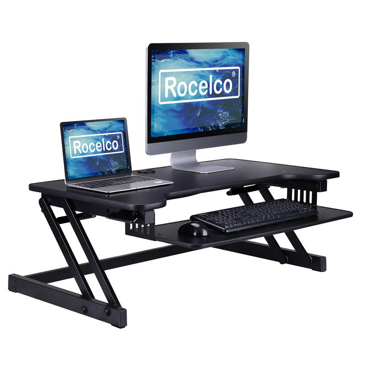a black desk with a computer and a monitor