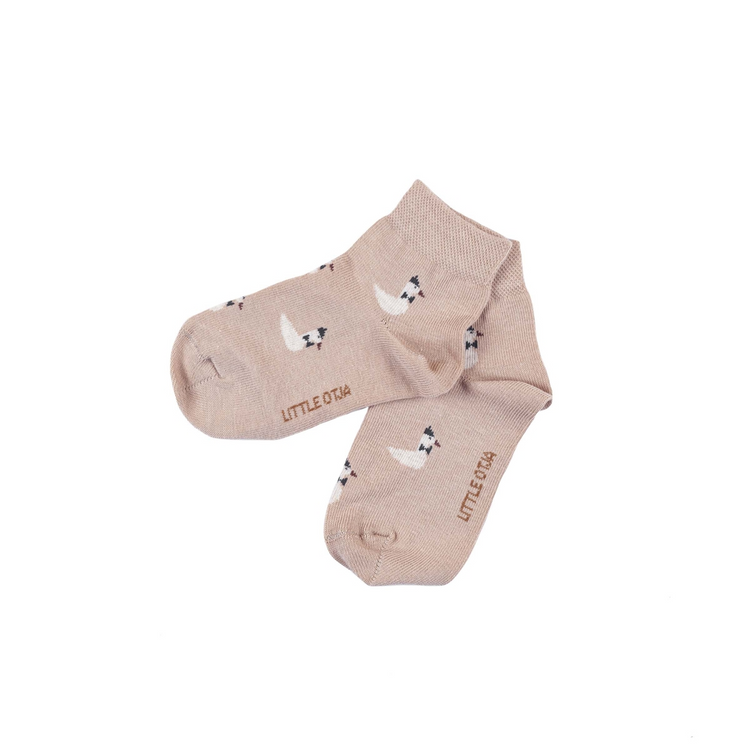 a pair of socks with white and black animals on them