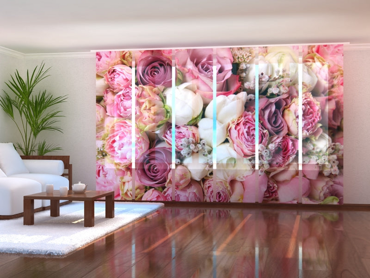 a room with a large floral wall
