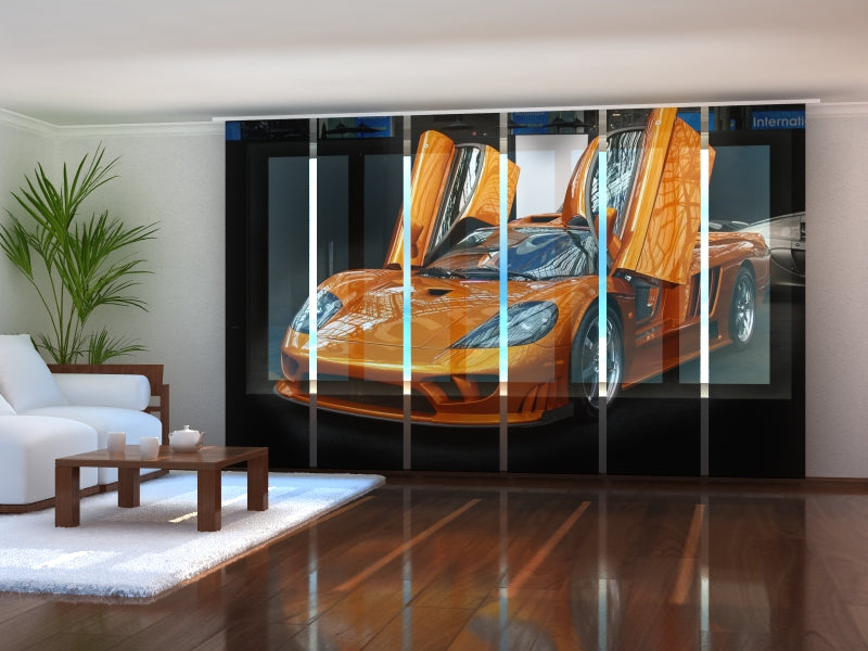 a room with a picture of a sports car