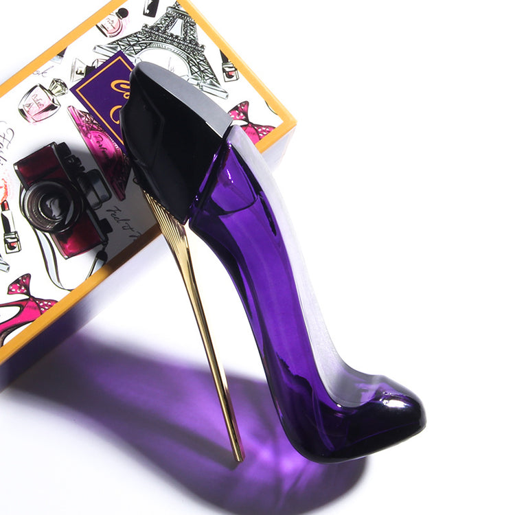 a purple bottle of perfume