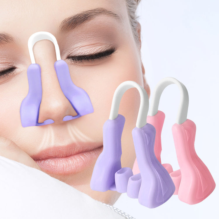 a woman with her eyes closed and nose clippers