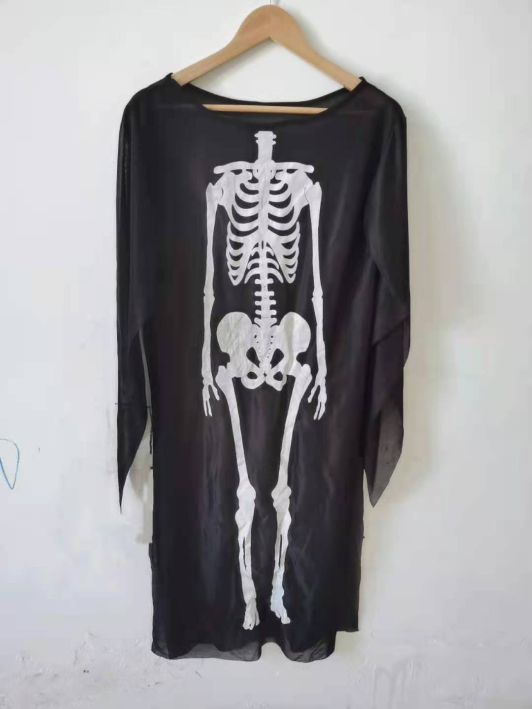 a skeleton shirt on a swinger
