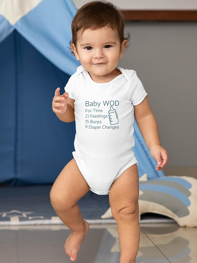 a baby standing in front of a blue tent