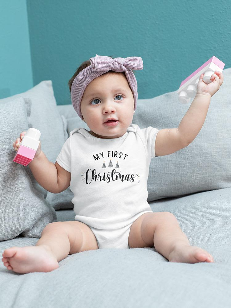 a baby holding a toy