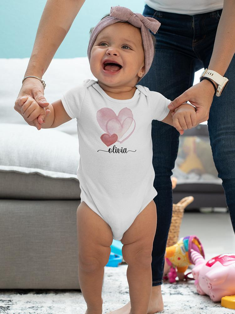 a baby standing in front of a person's hand