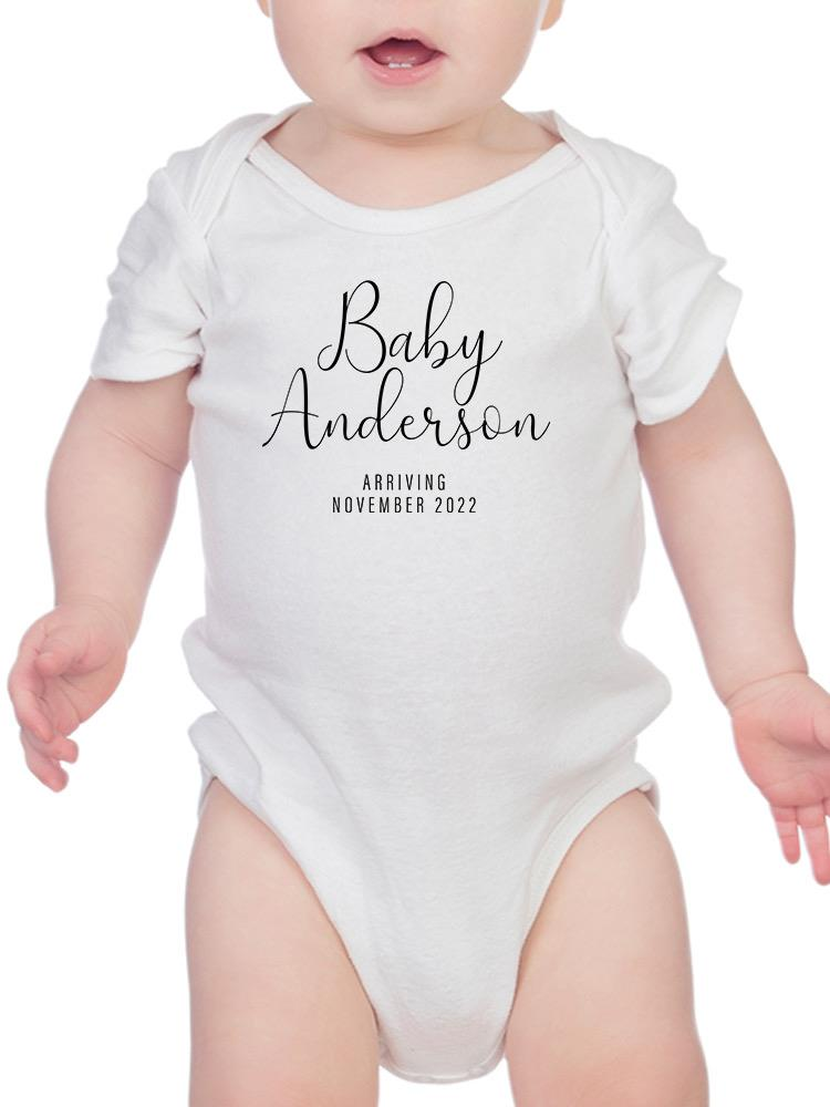 a baby in a white bodysuit