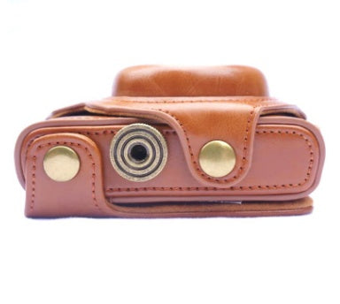 a brown leather case with a metal button