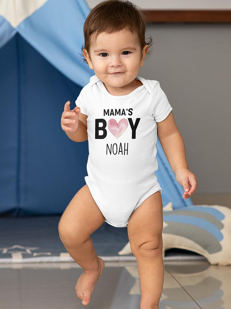 a baby standing in front of a blue tent