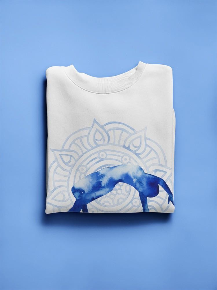 a folded white shirt with blue and white designs