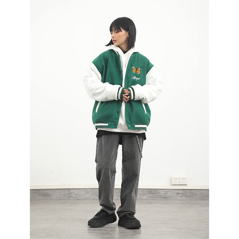 a woman in a green and white jacket