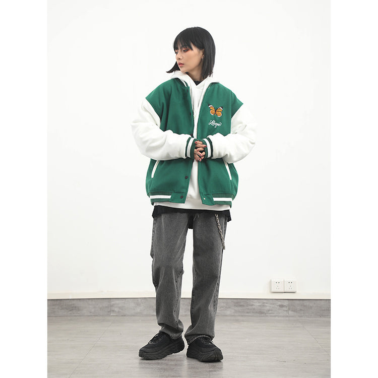 a woman in a green and white jacket