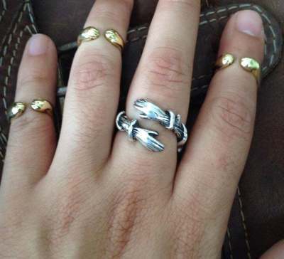 a hand with rings on it