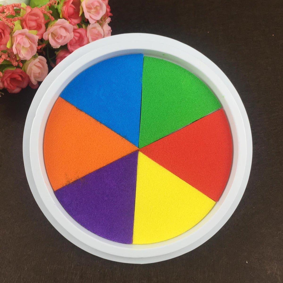 a colorful puzzle pieces in a white bowl