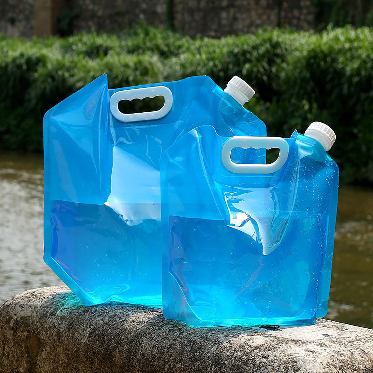 two blue plastic jugs on a rock