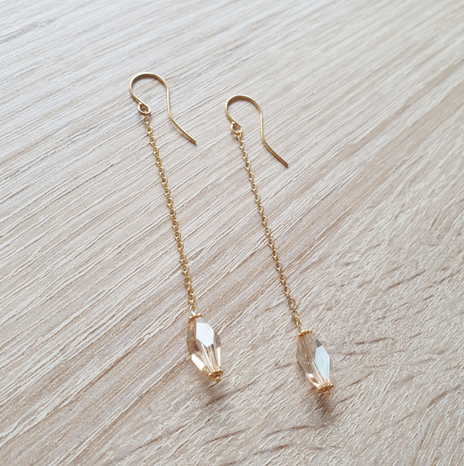 Gold dangle earrings with golden shadow crystals