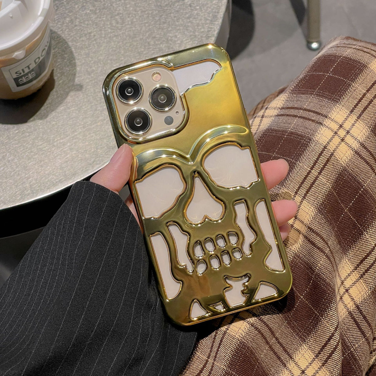 a person holding a phone case