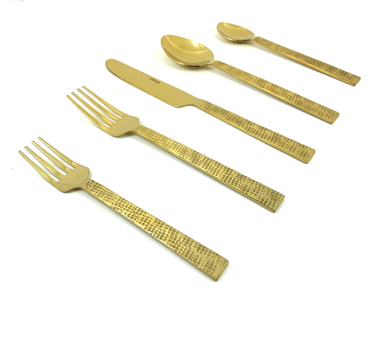 a group of gold cutlery