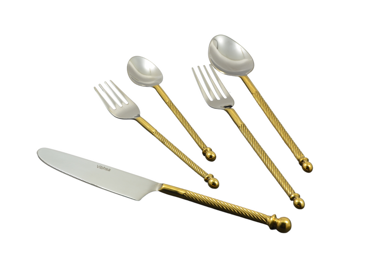 a silverware with a gold handle