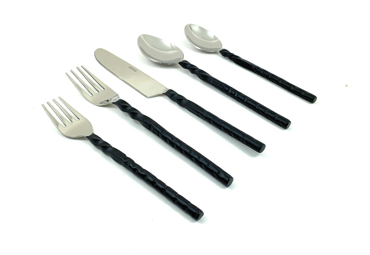 a group of silverware with black handles