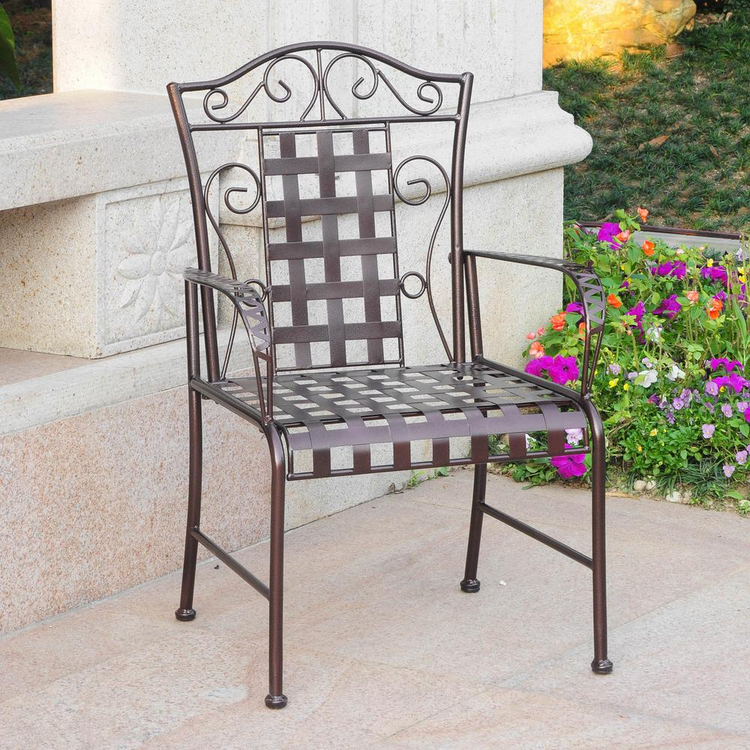 a chair outside with flowers