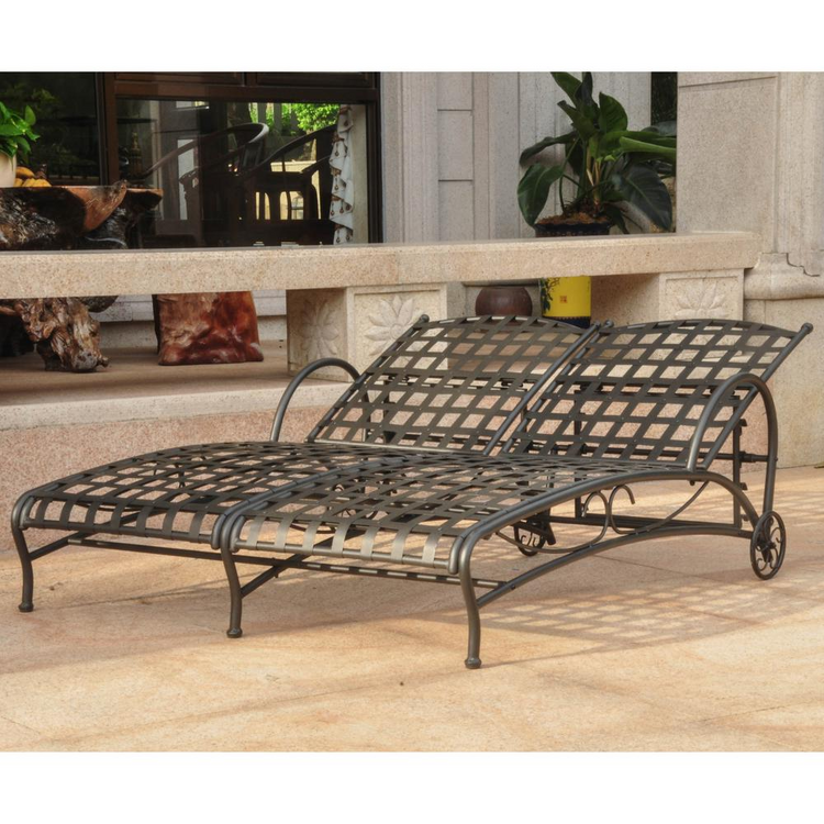 a metal lounge chair on a patio